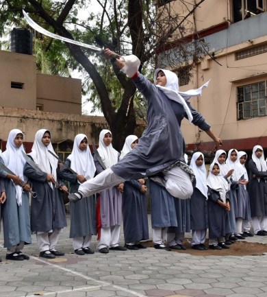 Student of St Maaz High Girls School displaying self defense and martial art skills after their training at Vovinam, a Vietnamese martial art institute, on the eve of International Women’s Day, at their school at Saidabad in Hyderabad on Tuesday. UNI